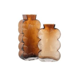 Set of amber-colored glass vases with a unique, rounded shape and texture, perfect for modern interiors.
