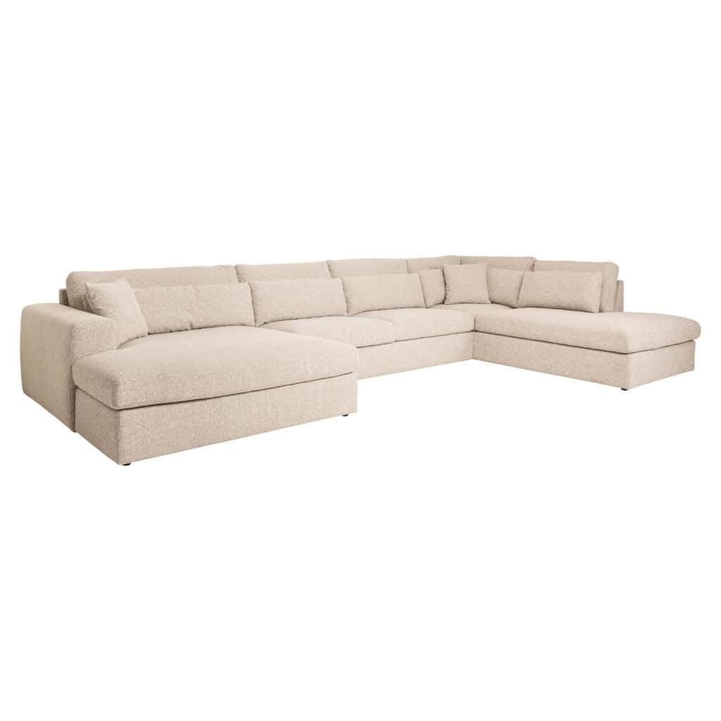 Luxurious beige corner sofa in a modern interior.