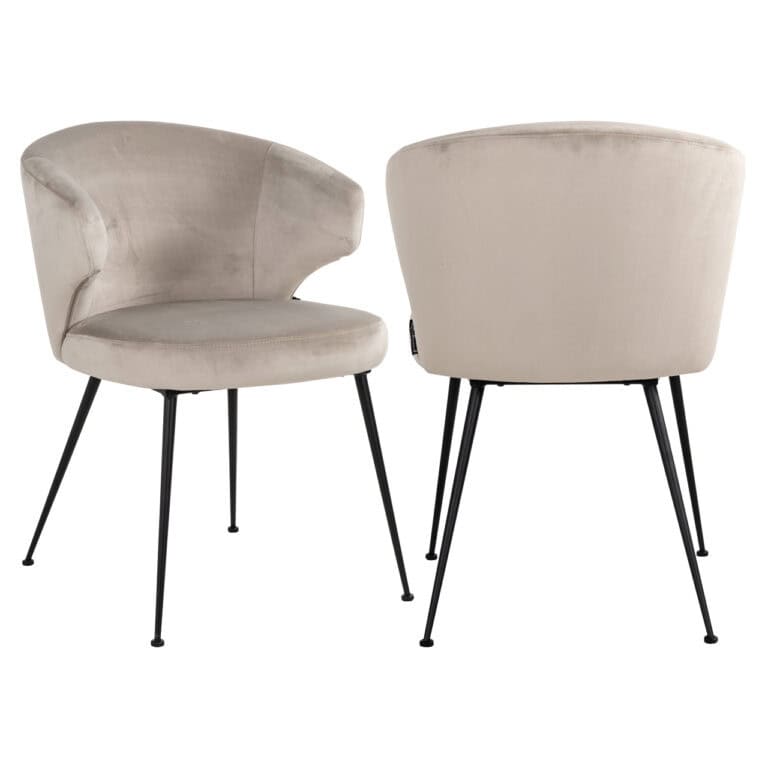Luxe beige velvet fauteuil met zwarte metalen poten, modern design.