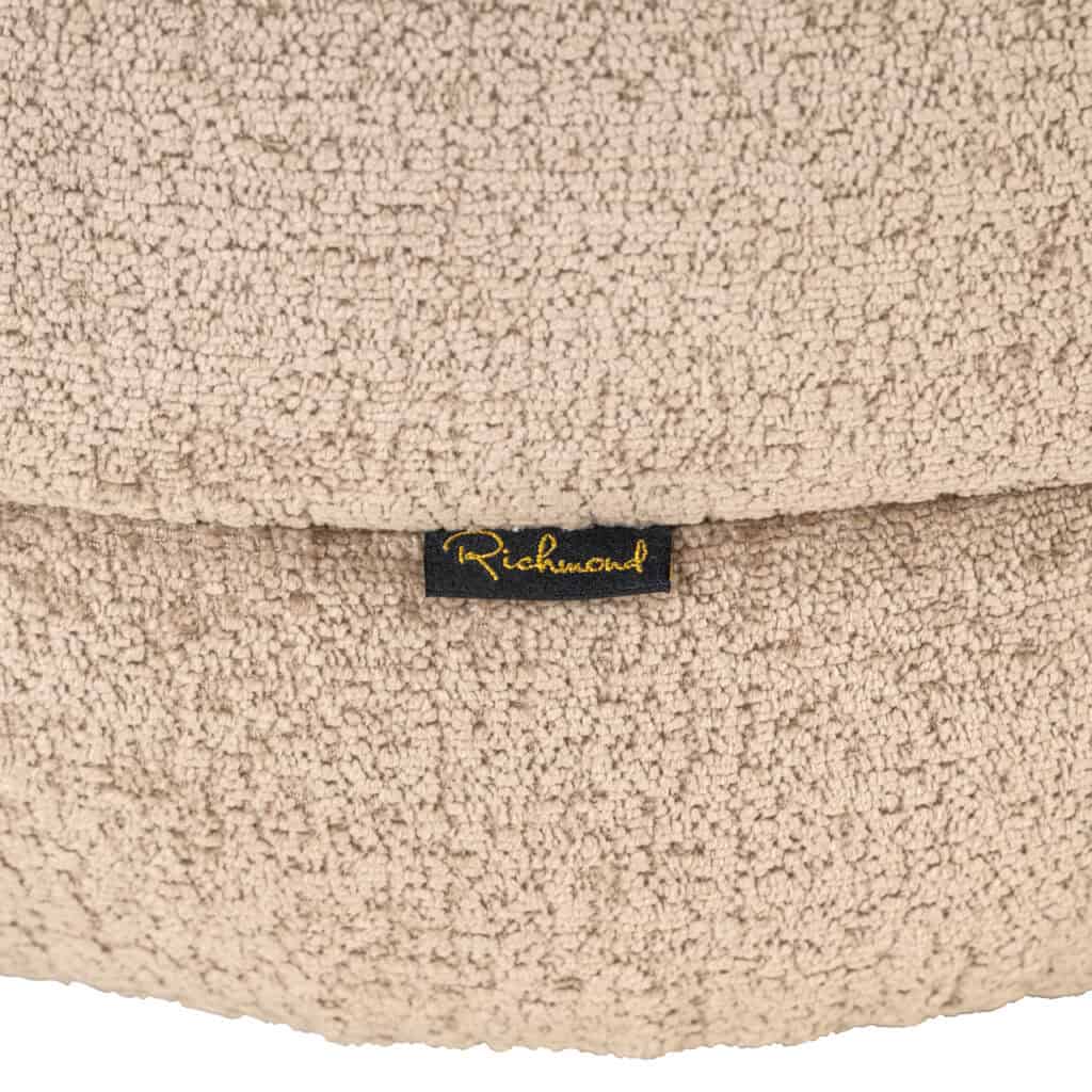Luxe beige textiel met Richmond logo, perfect voor interieurdecoratie.