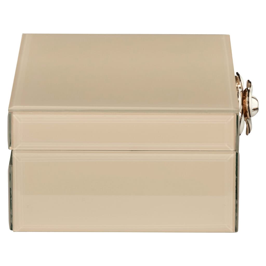 Elegant jewelry box with a mirror and gold accents, perfect for a luxurious interior and jewelry storage.