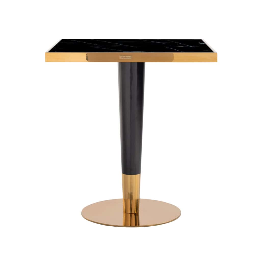 Table de bistrot moderne avec un plateau noir et des détails dorés.