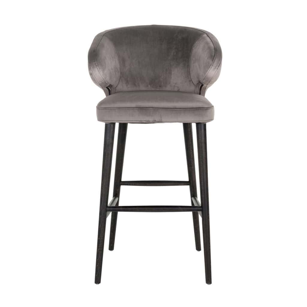 Modern bar stool with gray velvet upholstery and black wooden legs.