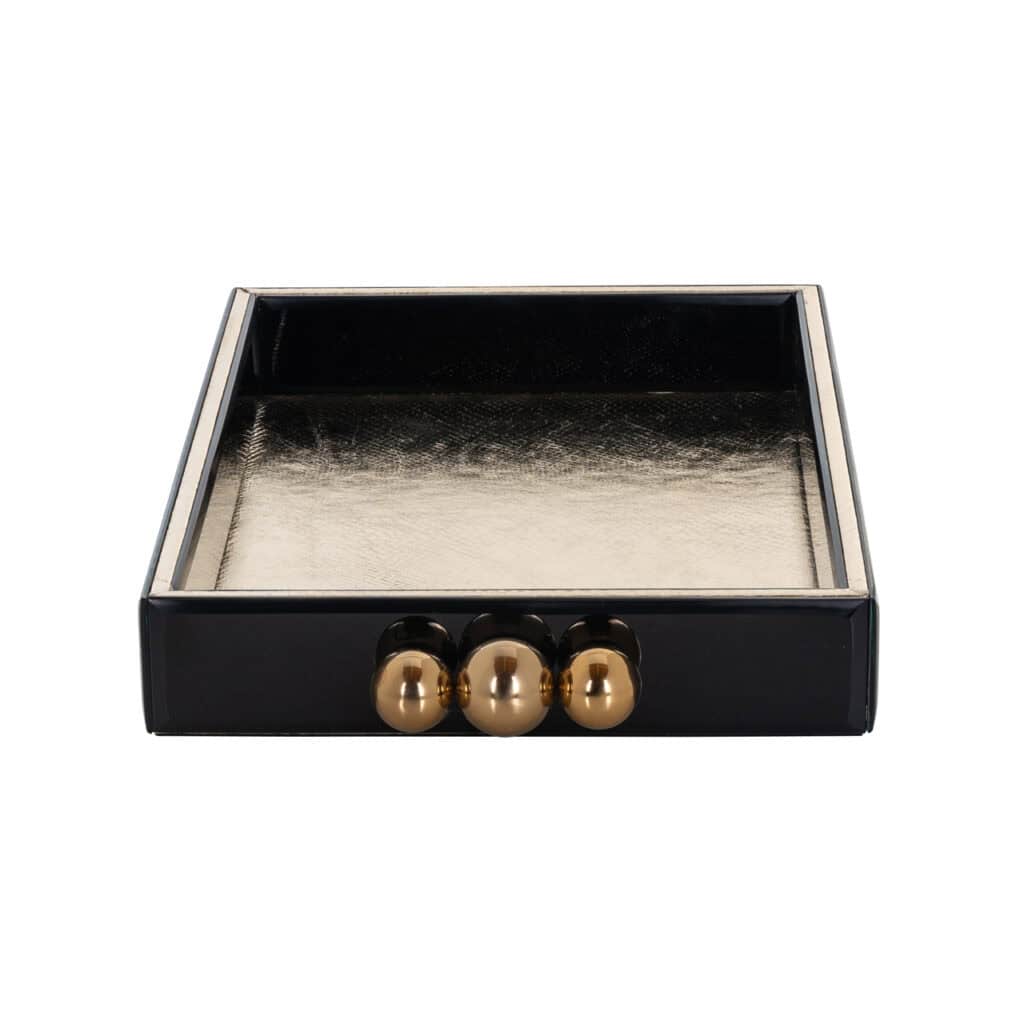 Elegantes Tablett mit schwarzem Rand und goldenen Knöpfen, luxuriöses Wohnaccessoire.