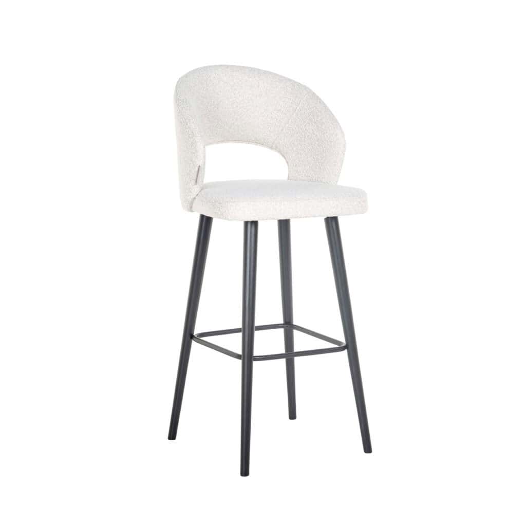 Modern bar stool with white bouclé upholstery and black legs.