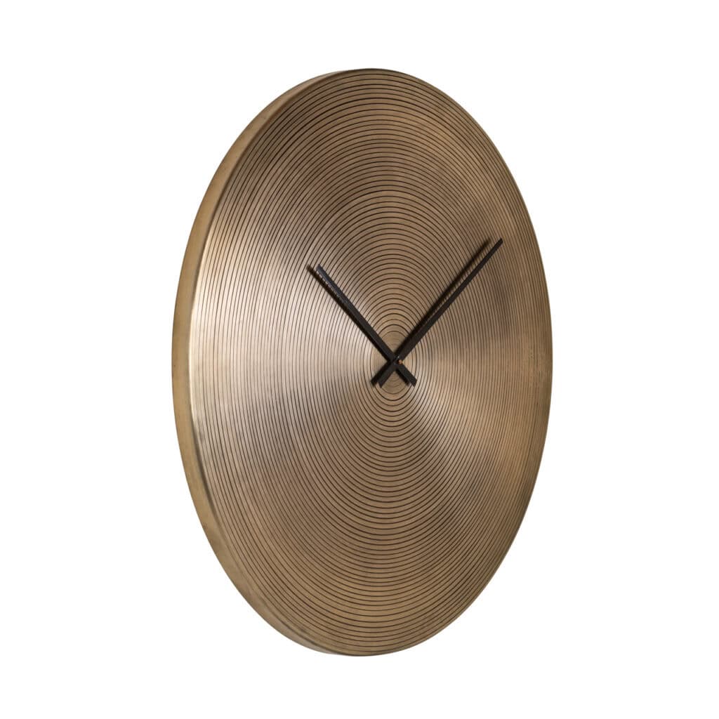 Gold clock with a round, ribbed design for modern interiors.