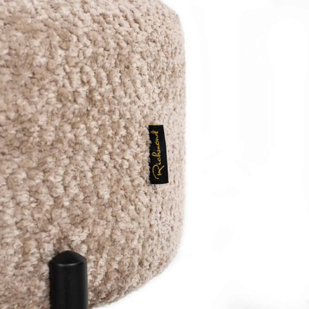 Dolly made of soft, natural wool with the Richmond logo.