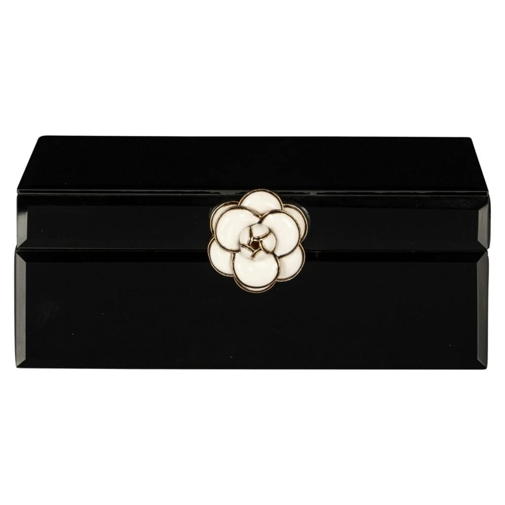 Small black storage box with a floral design for jewelry and accessories.