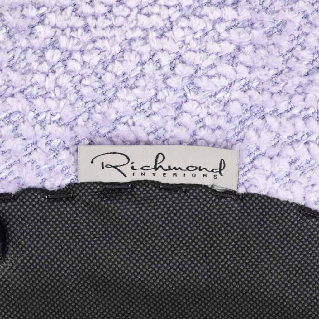 Ottoman and footstool in lavender-colored fabric from Richmond Interiors.