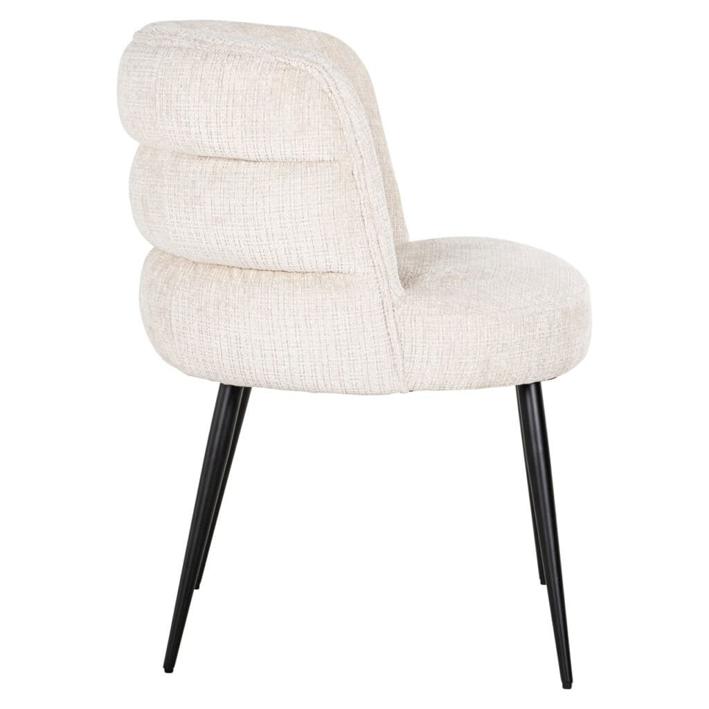 Modern beige dining chair with black legs for an elegant interior.