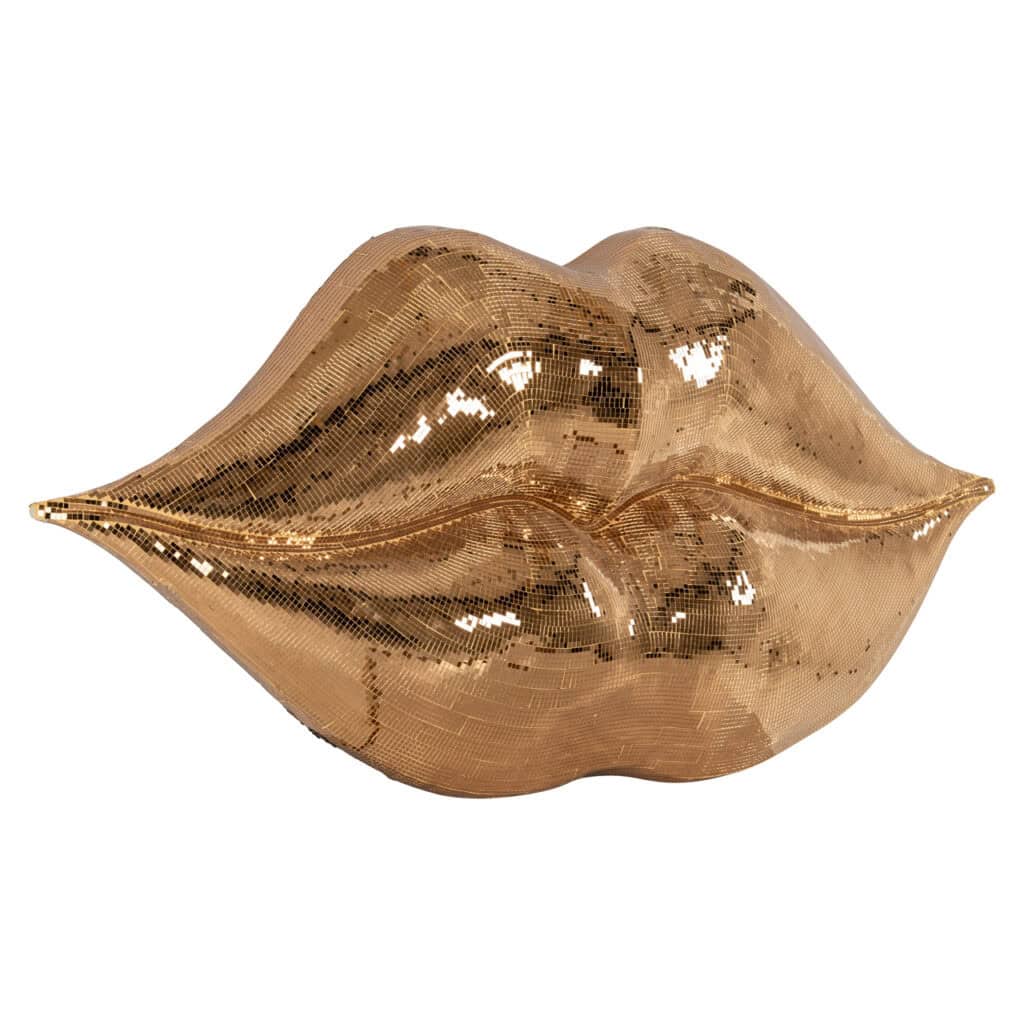 Golden lips sculpture as a stylish piece of interior decor.