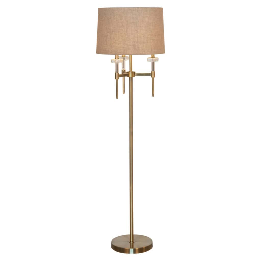 Élégant lampadaire Josie avecgold  brushed  et un abat-jour beige.
