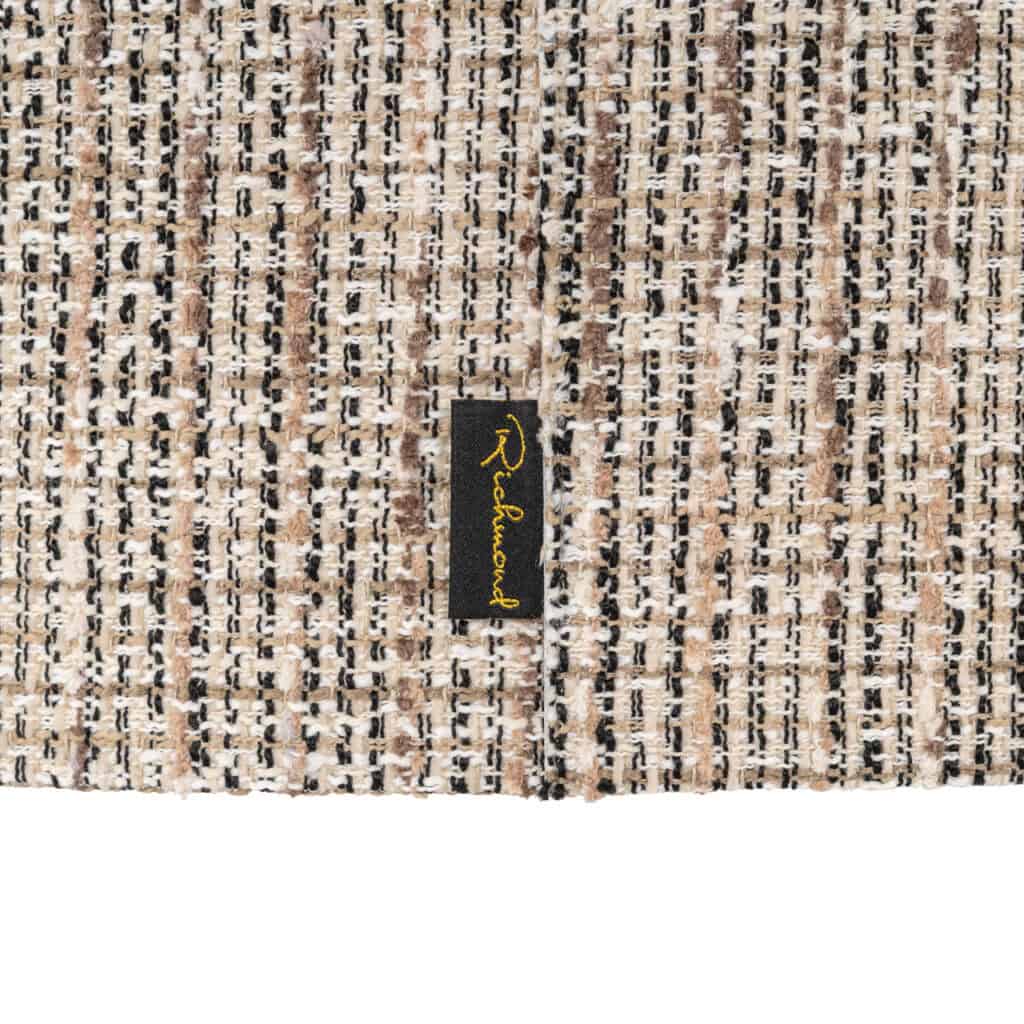 Luxury fabric with a black-and-white pattern and a Richmond Interiors label.