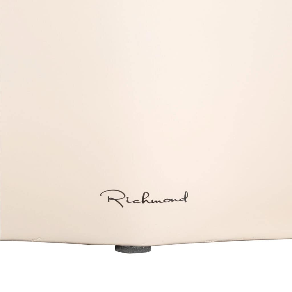 Richmond Interiors logo on elegant furniture piece.