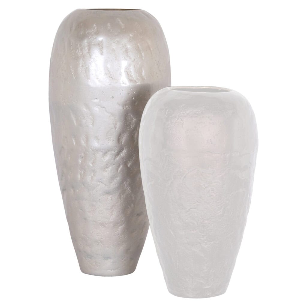Two white ceramic vases with a rough texture for interior decoration.