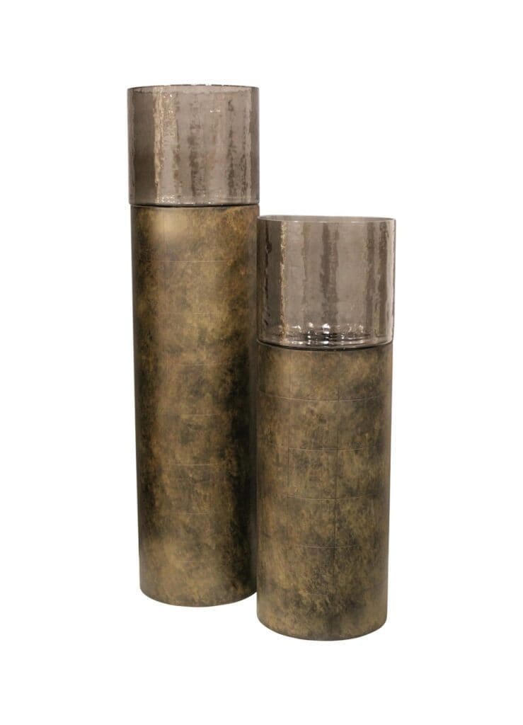 Set of gold-colored metal vases with glass lids for modern interiors.