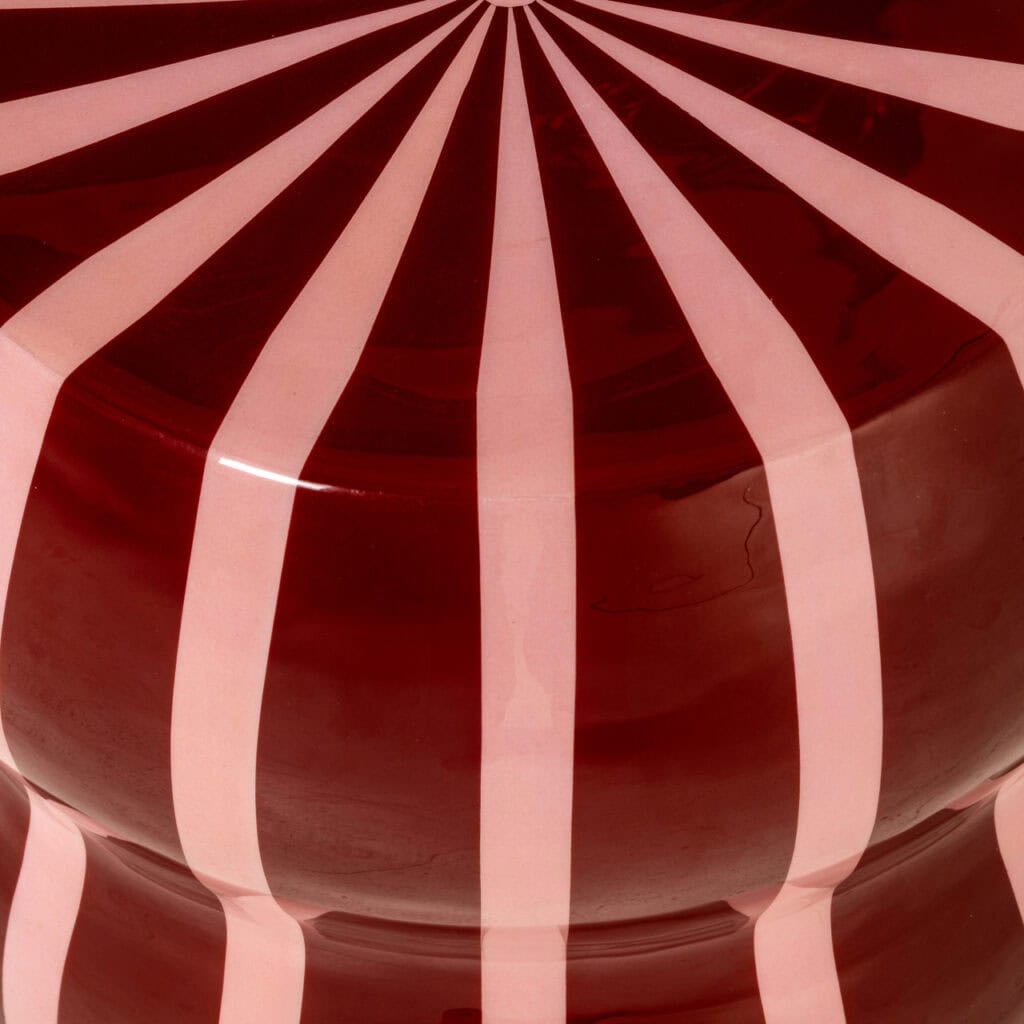 Red-and-white striped beach umbrella for summer days at the beach.
