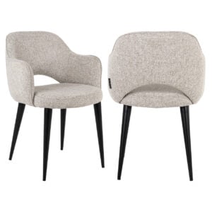Modern beige upholstered armchair and dining chair with black wooden legs.