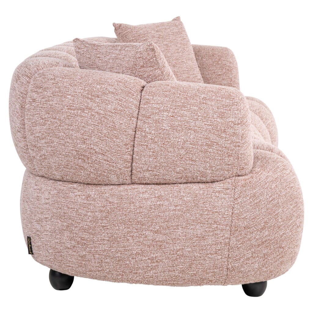 Comfortable pink lounge chair with soft upholstery and rounded shapes, perfect for modern interiors.