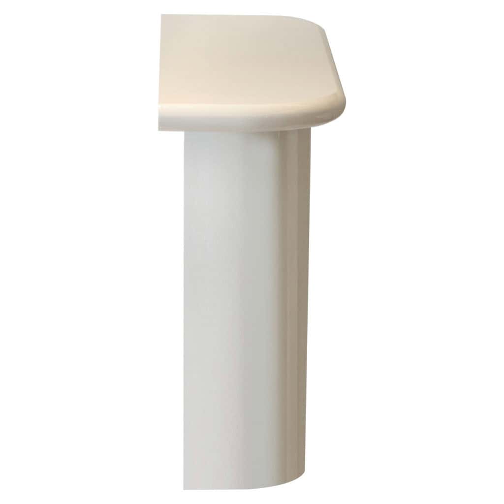 Modern white table with rounded corners, suitable for interior design.