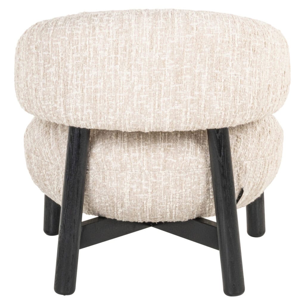 A bench with beige fabric upholstery and black wooden legs, perfect for modern interiors and living rooms.