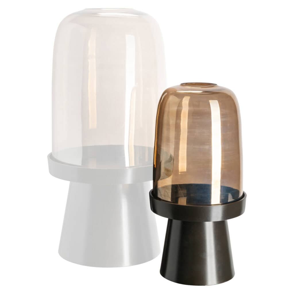 Modern lamp with a glass shade and black base—a stylish home decor accessory.