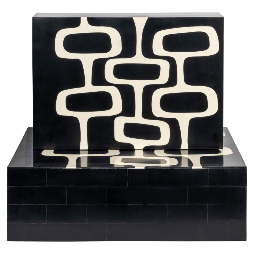 Modern black-and-white interior cabinet with a geometric pattern for a stylish living space.