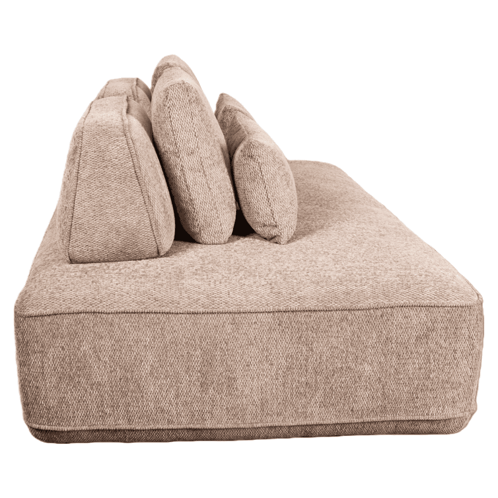 A modern lounge sofa with soft cushions in a contemporary interior.