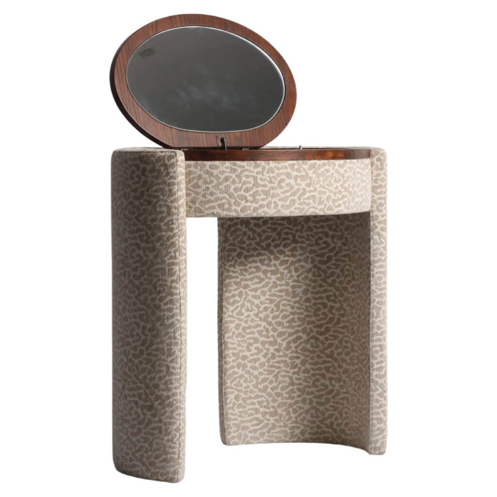 Roxenne desk with beige leopard-print upholstery and a round mirror.