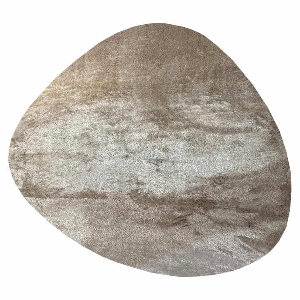 Beige Pebble vloerkleed met natuurlijke textuur en ronde vorm.
