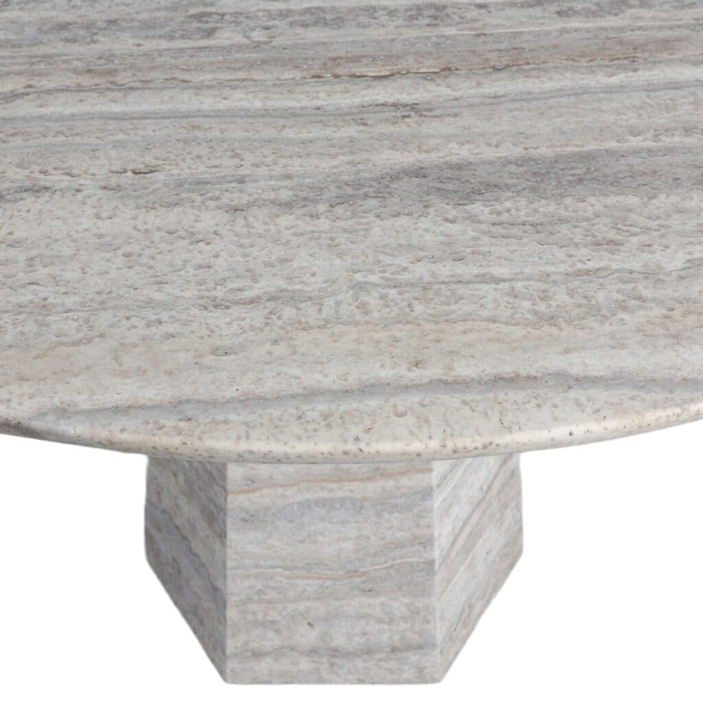 Moderne grijze eettafel met ronde top en stevige basis.