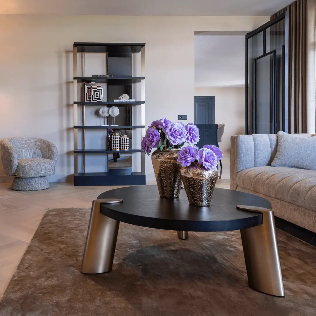 Modern living room with stylish furniture and decorative elements.