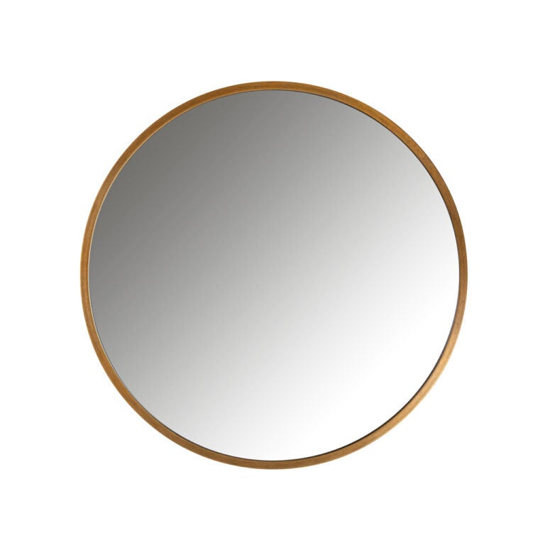Round gold mirror with a minimalist design for interior decoration.