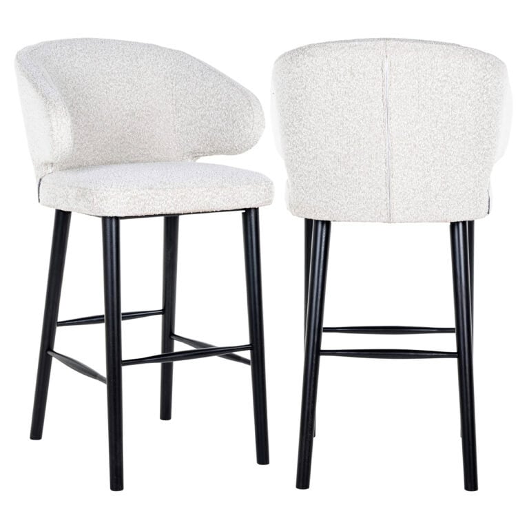 Modern bar stool with white bouclé upholstery and black wooden legs.