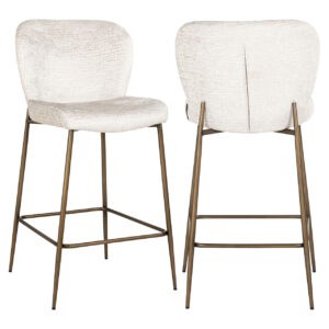 Elegant Darby with cream upholstery and gold-colored legs.