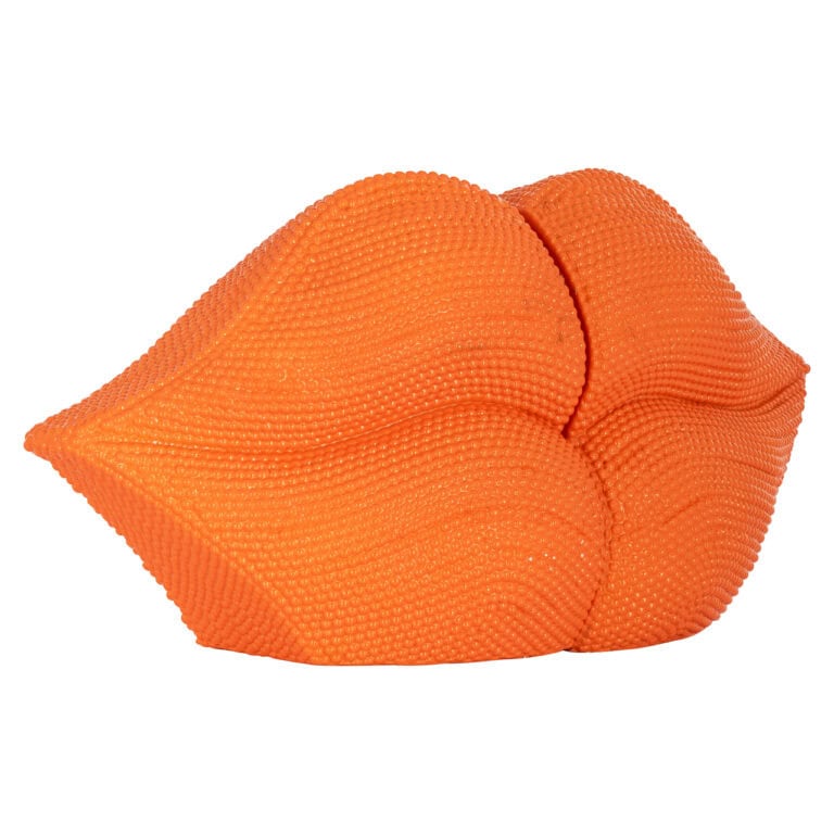 Oranje lips vormige boekstandaard voor interieurdecoratie.