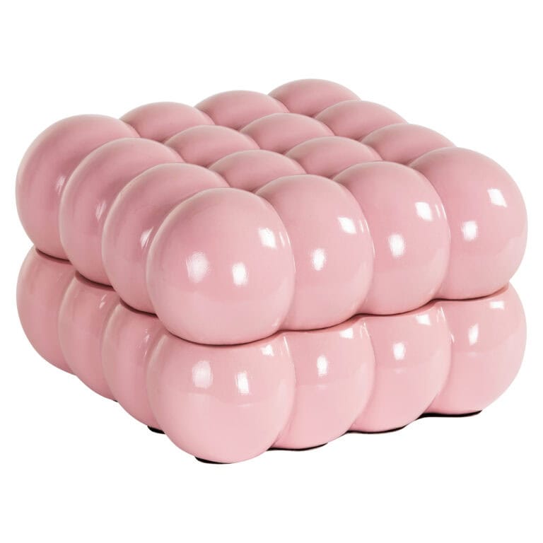 Roze kleine opbergdoos met bolvormige structuur voor interieur.