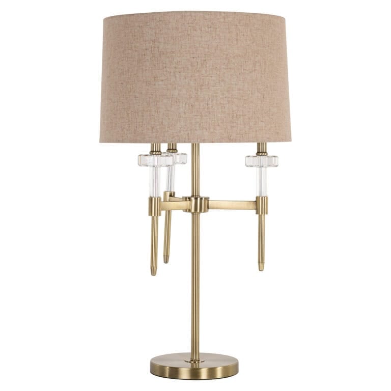 Élégante lampe de table Josie avecgold  brushed  et un abat-jour beige.