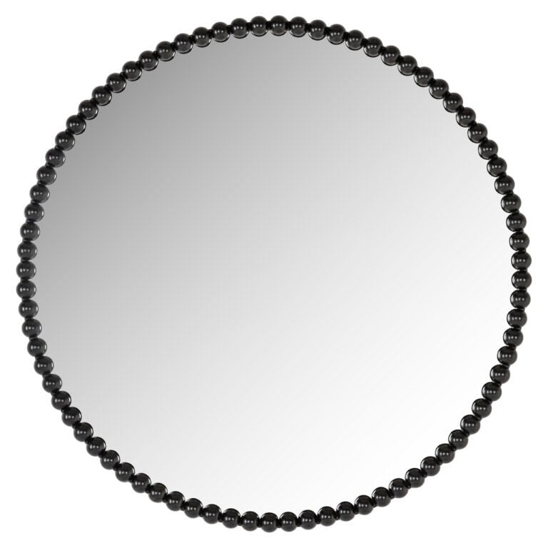 Rond spiegel met zwarte parelrand, modern interieuraccessoire.