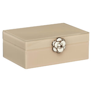 Petite boîte de rangement de couleur ivoire avec un couvercle en forme de bouton de fleur.