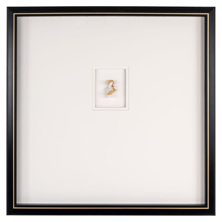 Black-and-white wall art featuring the number 2 in a white frame.