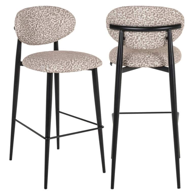 Modern bar stools with a beige geometric pattern and black legs.