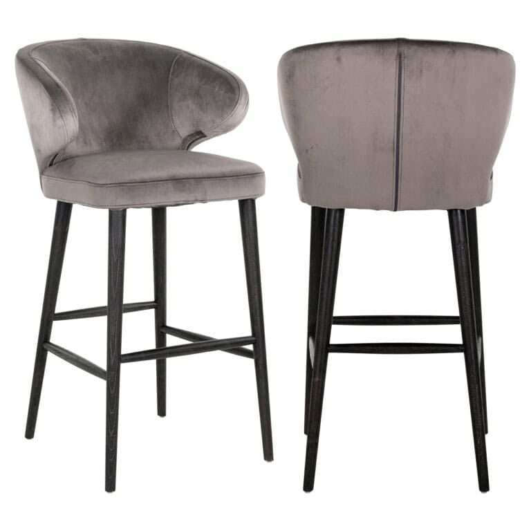 Tabouret de bar moderne en velours gris, avec des pieds en bois noir.