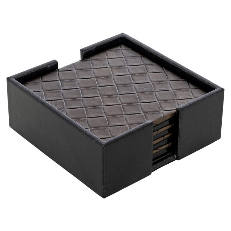 Luxury wine and bar accessories on a black leather background.