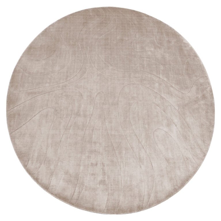 Rond vloerkleed Addison in neutrale beige tint voor elegante interieurs.