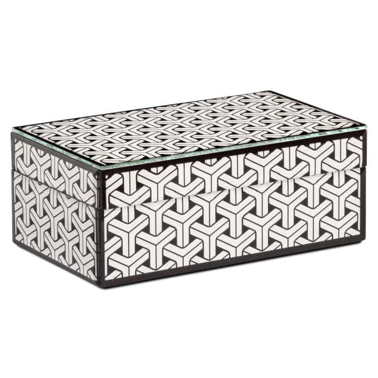 Petite boîte de rangement noire et blanche à motifs géométriques.