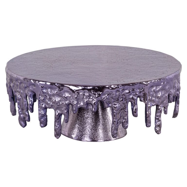 Plateau à gâteau , un modèle unique orné de détails brillants en forme de goutte, dans une finition métallisée.