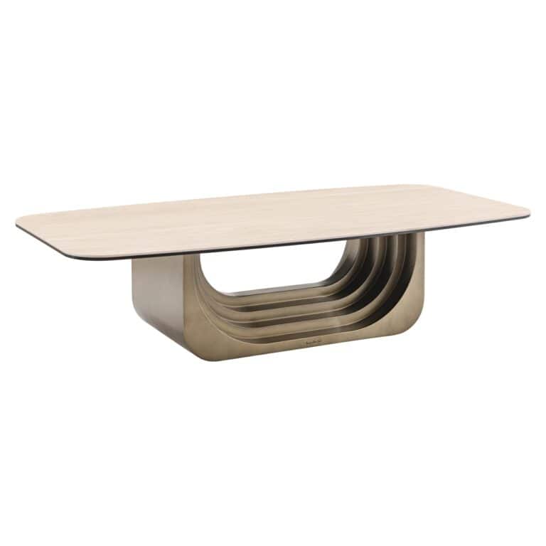 Table de salon e moderne de couleur beige, dotée d'un piètement métallique unique.