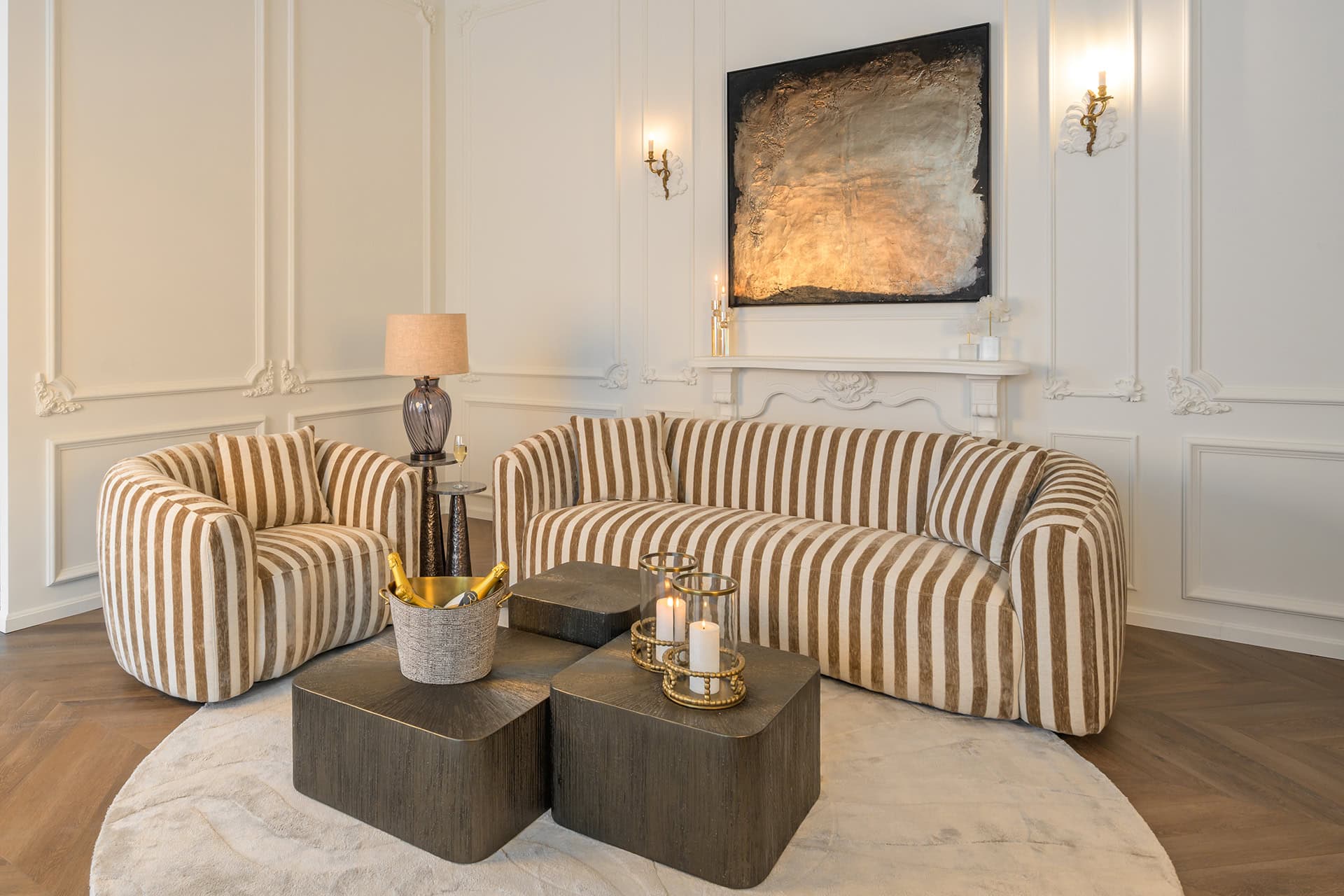 Elegant living room with striped sofas and modern decor.