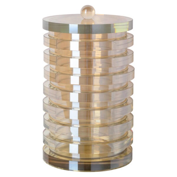 Amber storage box with rounded layers and a gold knob on top.